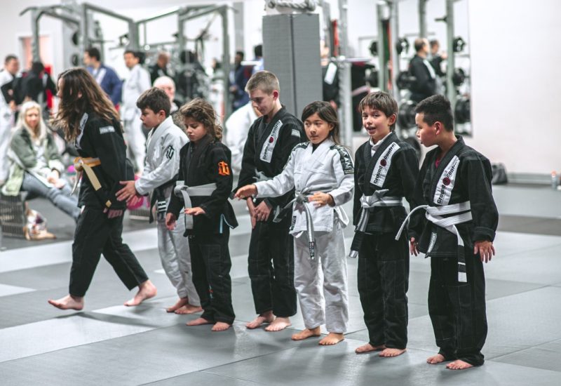 Kids lined up in a junior champs martial arts class
