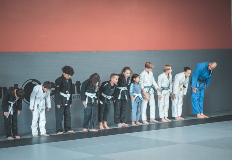 Line of kids bowing in a martial arts class